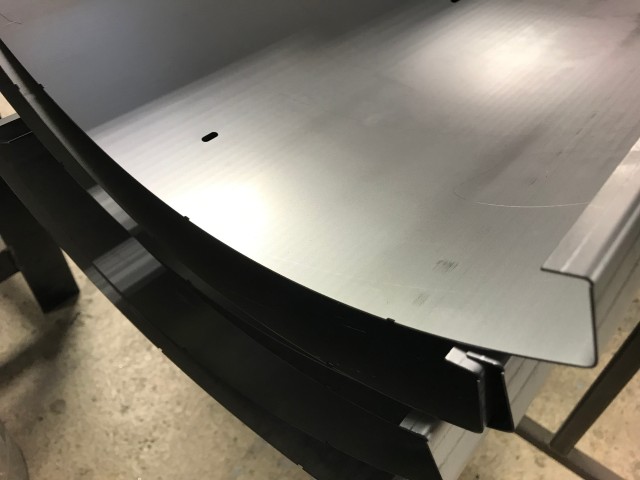Forming curves in sheet metal with CNC press brakes and standard tooling